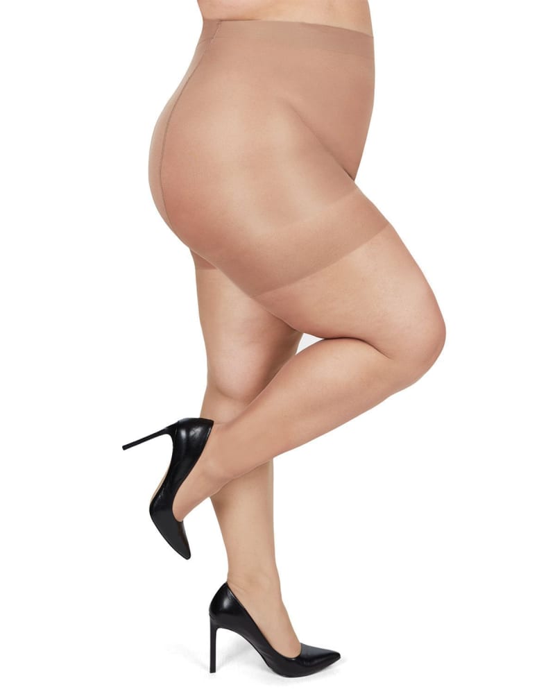 Side of a model wearing a size 3X-4X Plus Size Curvy Silky Sheer Control Top Pantyhose in Nude by Memoi. | dia_product_style_image_id:299614